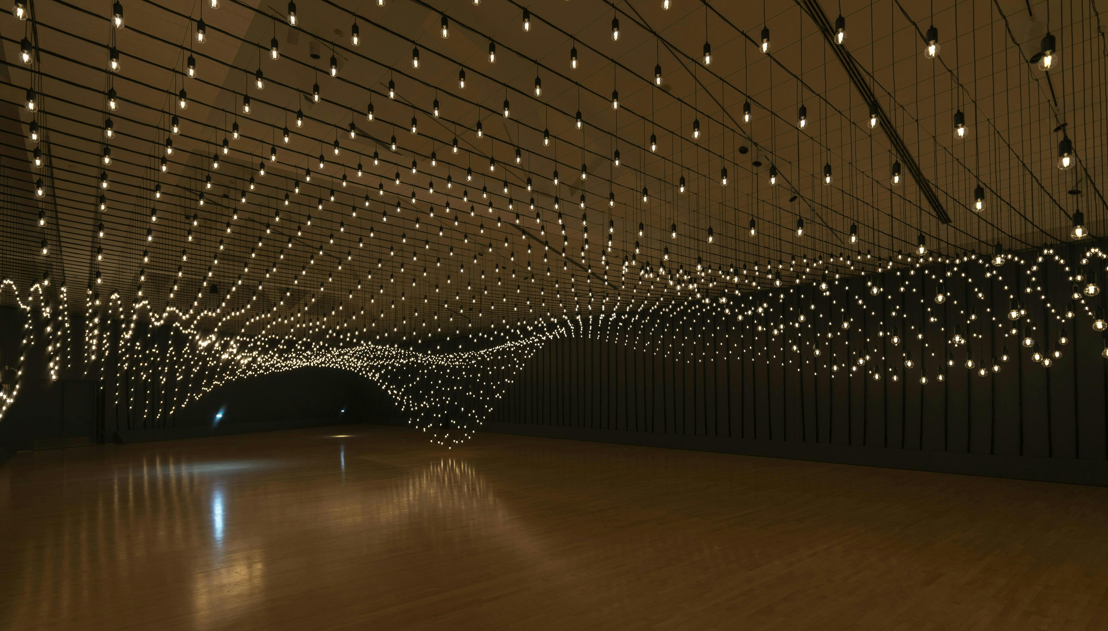Hanging lights in an empty room.