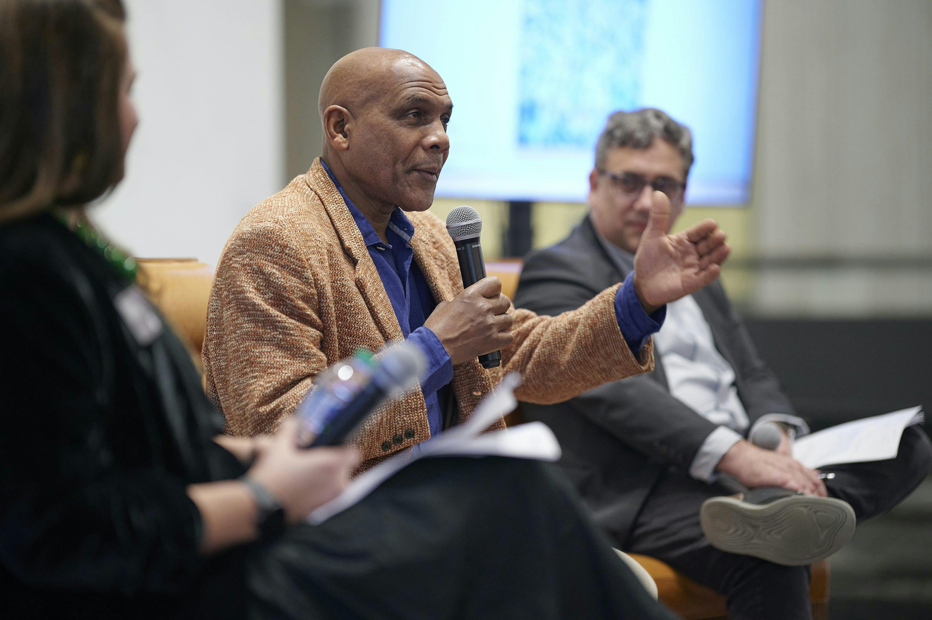 Photo of Denzil Forrester speaking in a panel discussion at Kemper Museum
